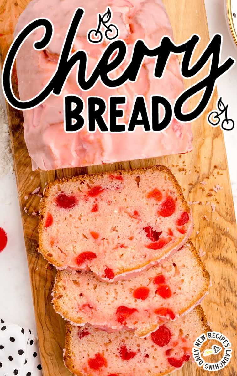 close up overhead shot of a loaf of Cherry Bread with pieces of bread sliced off on a wooden board