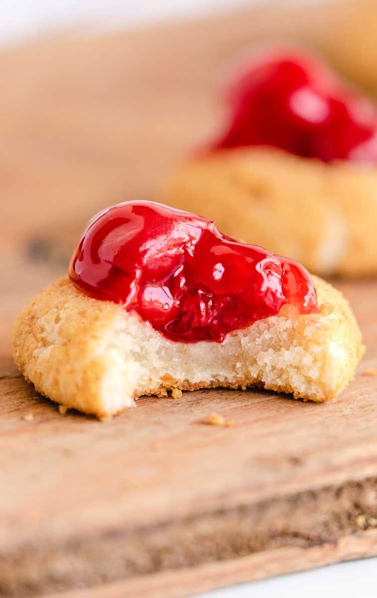 close up shot of Cherry Cheesecake Cookies on a wooden board