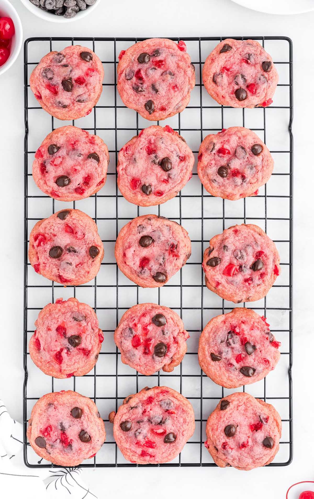 close up shot of Cherry Chocolate Chip Cookies on a cooling rack