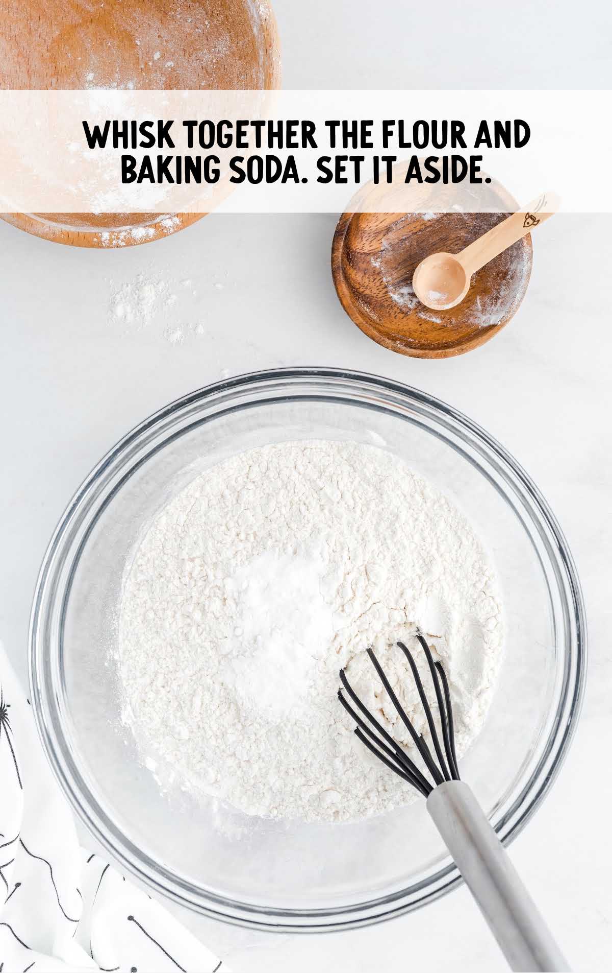 flour and baking soda whisked together in a bowl 