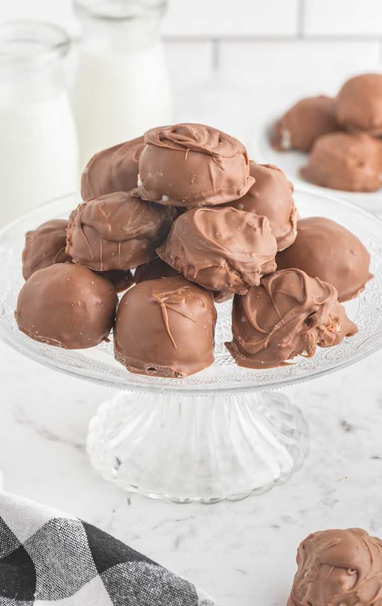 close up shot of a pile of Chocolate Coconut Balls on a serving plate