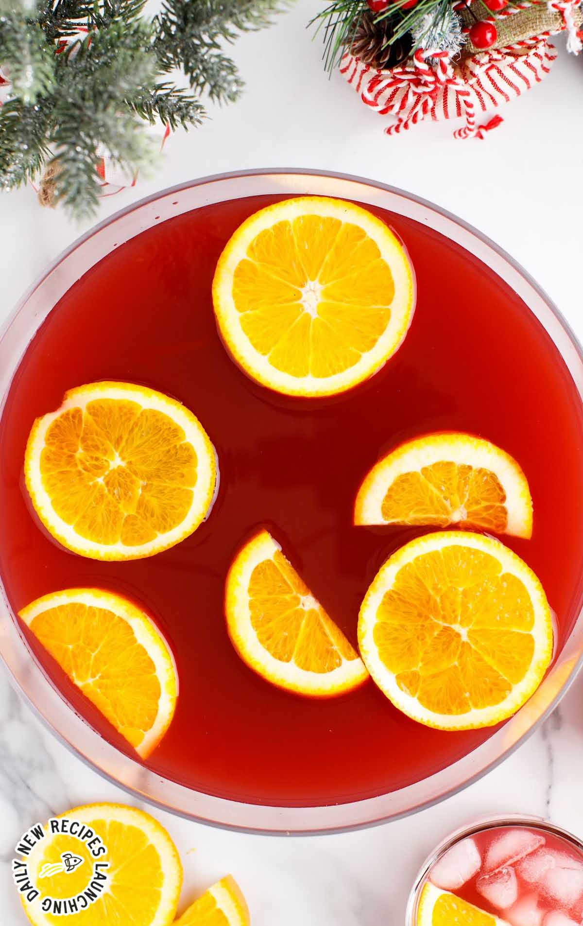 a punch bowl of punch with orange slices