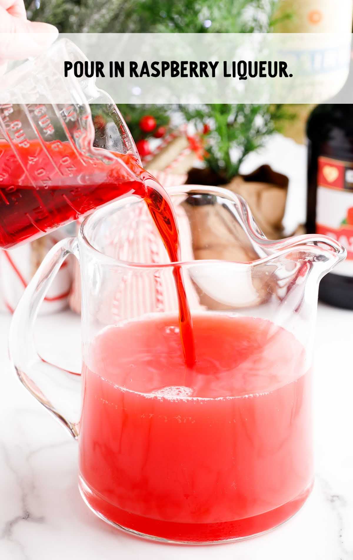 raspberry liqueur poured into pitcher