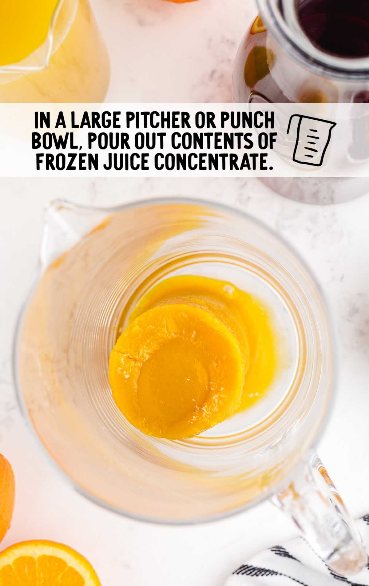 orange juice concentrate in a large pitcher