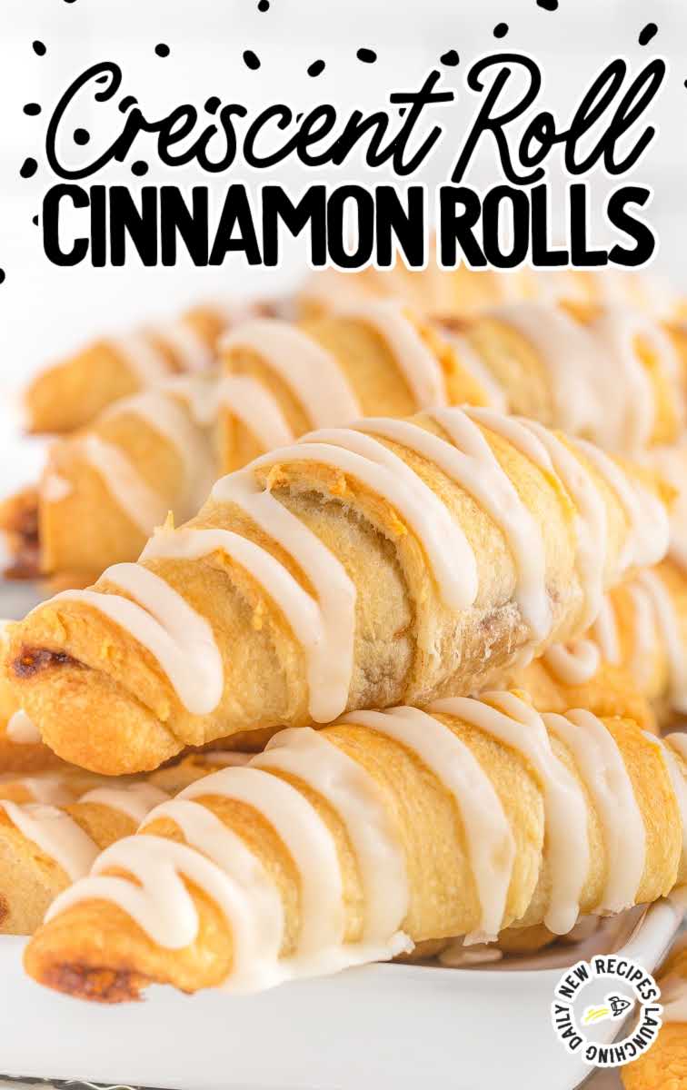 close up shot of a bunch of Crescent Roll Cinnamon Rolls drizzled with glaze