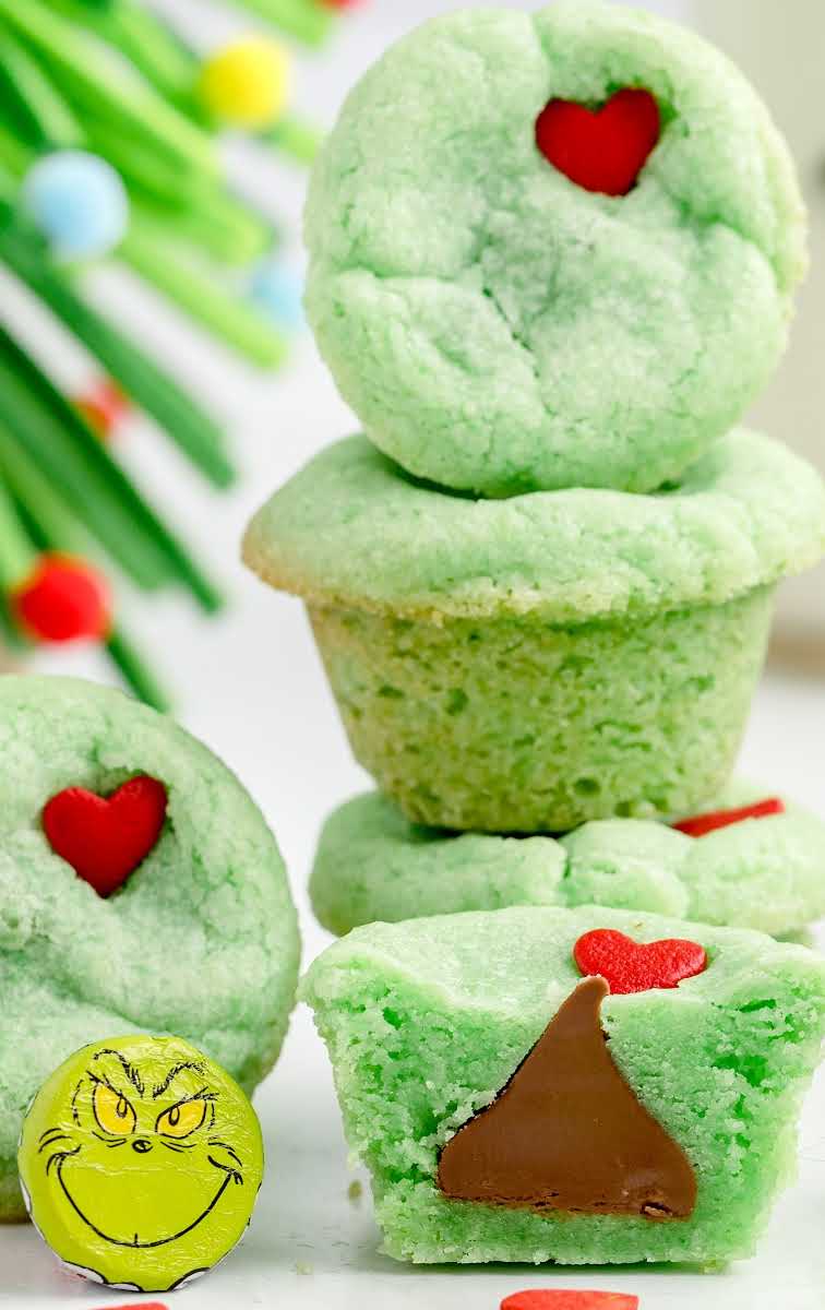 close up shot of Grinch Stuffed Cookies topped with a heart candy sprinkle