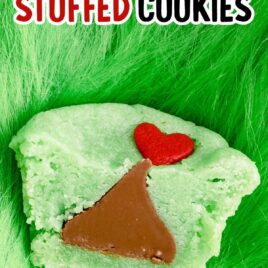 close up overhead shot of Grinch Stuffed Cookies topped with a heart candy sprinkle