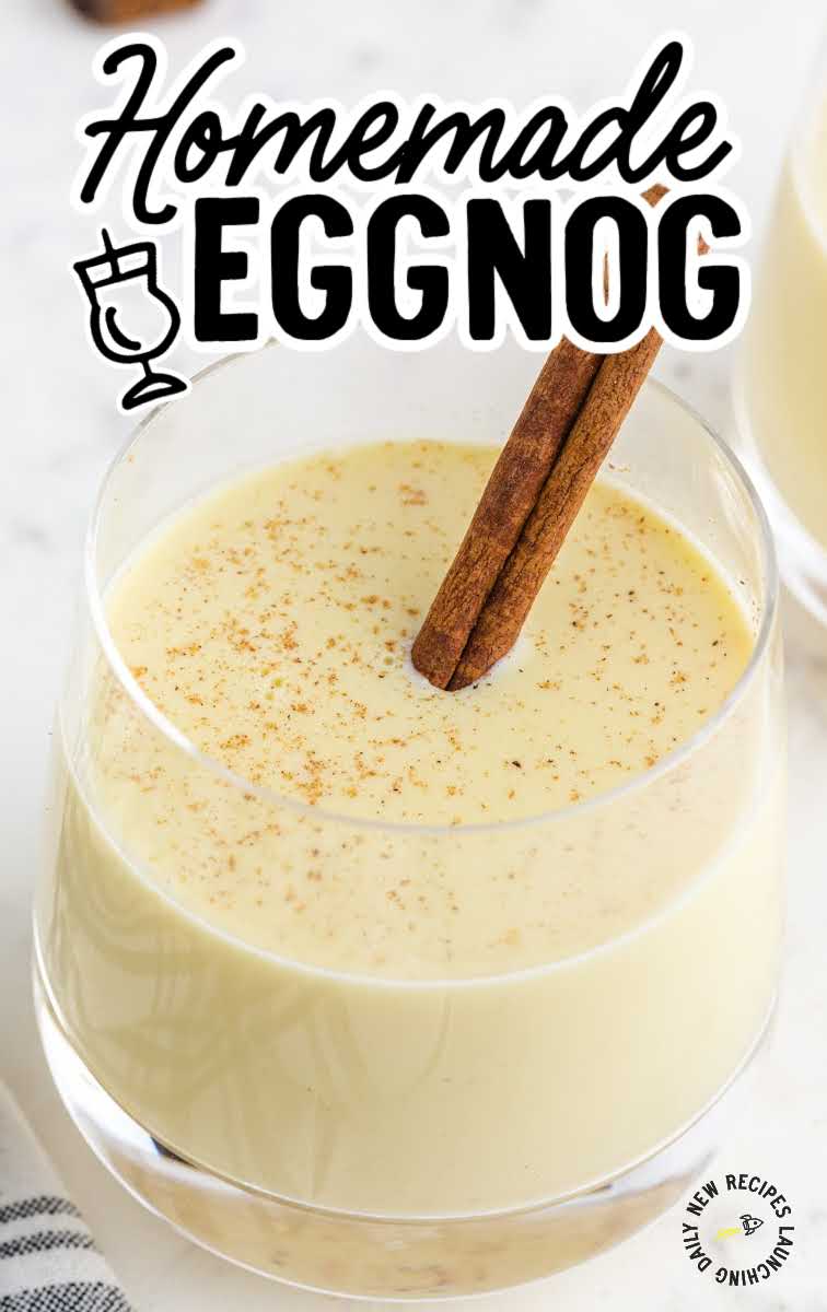 close up shot of a glass of Homemade Eggnog topped with a cinnamon stick