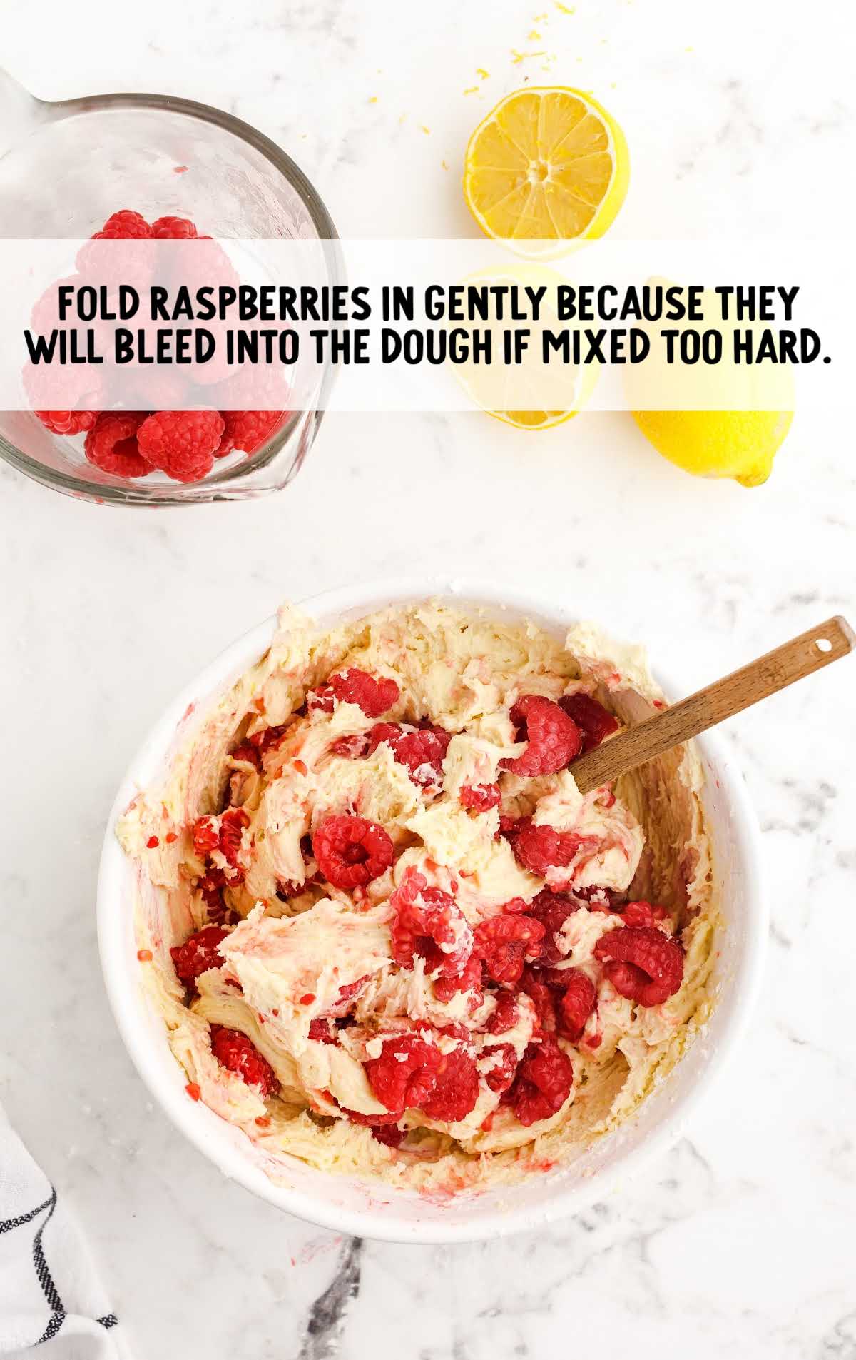 raspberries folded into the dough