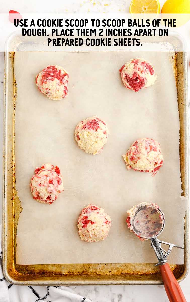 Lemon Raspberry Cookies process shot of cookie scoop balls placed on a sheet pan