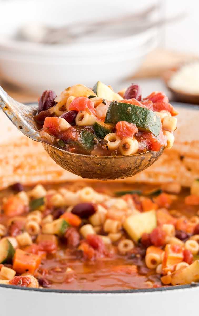 close up shot of a large spoonful of Minestrone Soup