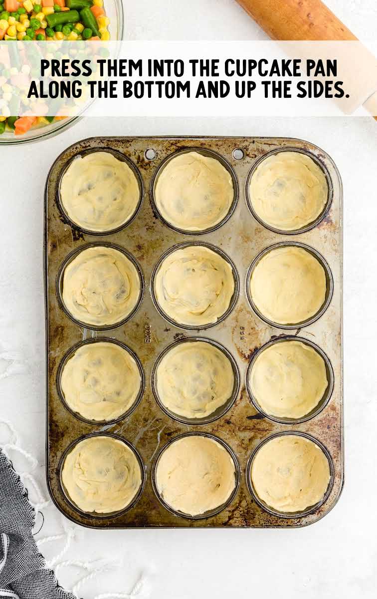 Mini Chicken Pot Pies process shot of crescent rolls dough placed inside the cupcake pan