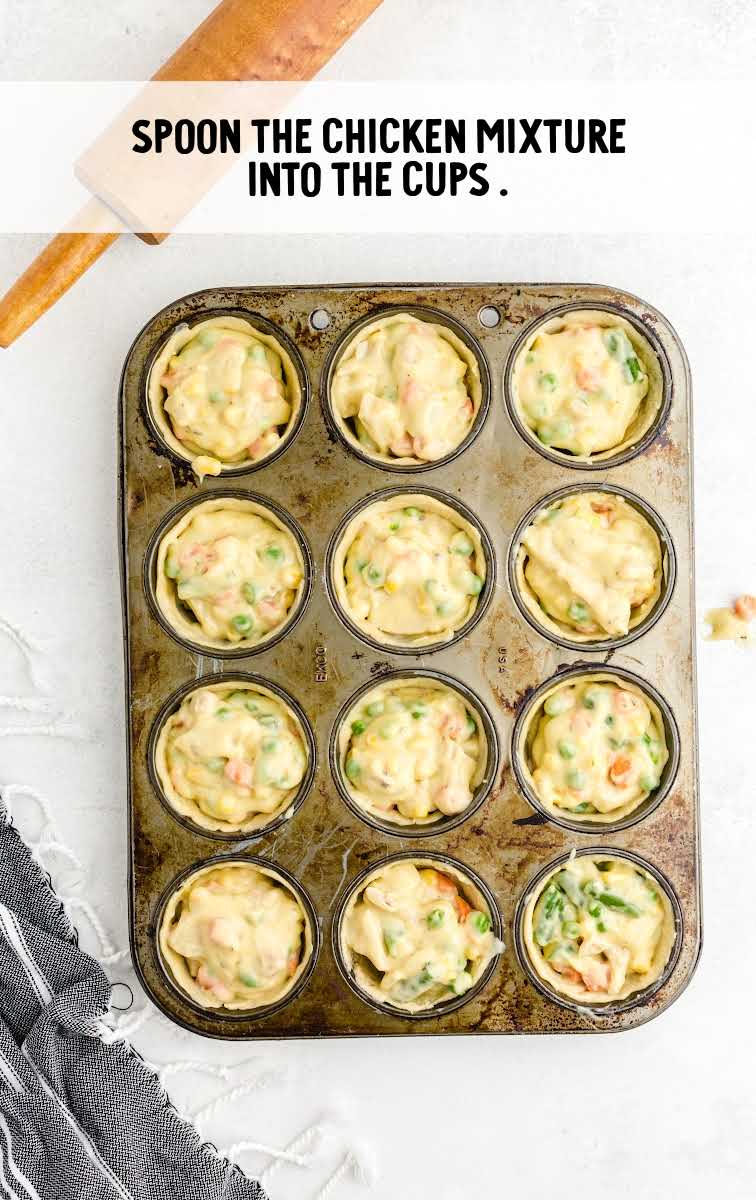 Mini Chicken Pot Pies process shot of chicken mixture spooned into the dough cups