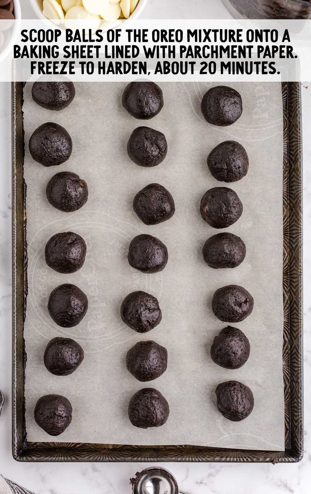 oreo mixture scooped into balls and placed on a baking sheet