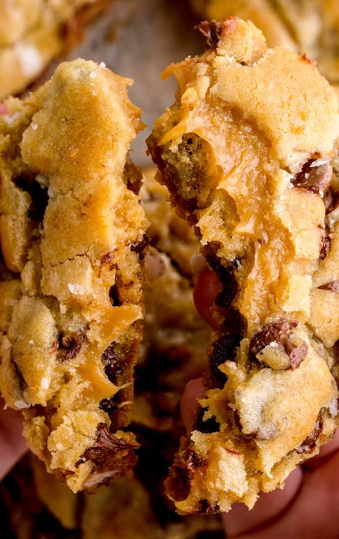 close up shot of Salted Caramel Chocolate Chip Cookie Bars being broke in half