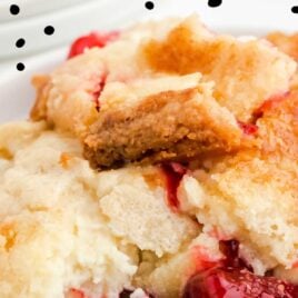 close up shot of a serving of Strawberry Dump Cake on a plate