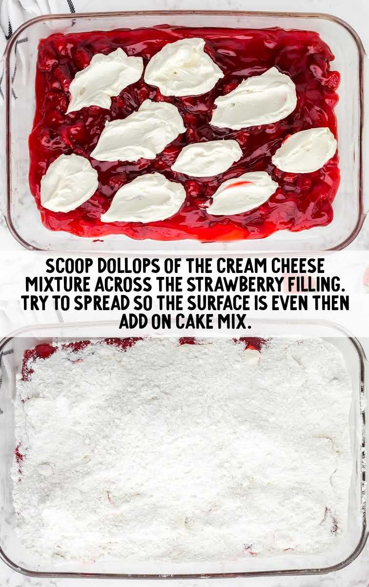 scoops of cream cheese spread over the top of the strawberry filling in a baking dish