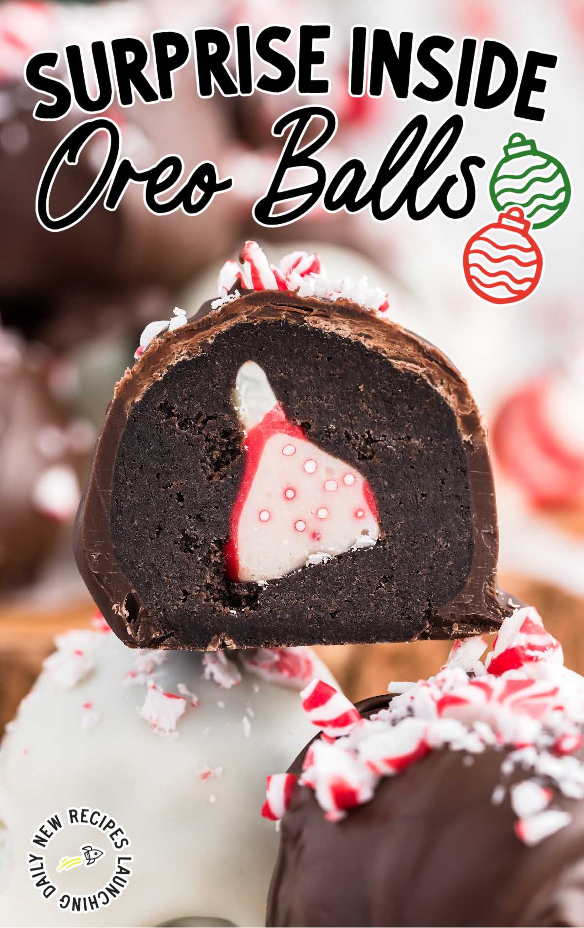 close up shot of Surprise Inside Oreo Balls sprinkled with crushed peppermint piled on top of each other