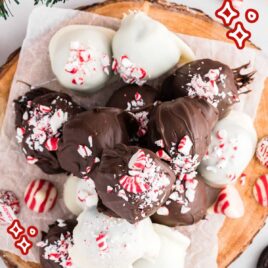 close up overhead shot of Surprise Inside Oreo Balls sprinkled with crushed peppermint on a wooden board