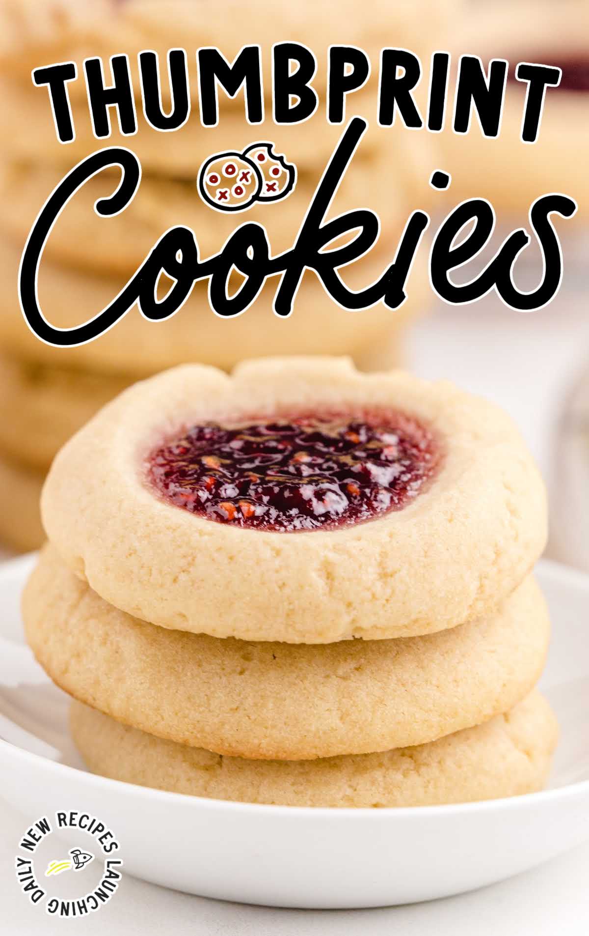 close up shot of a bowl of Thumbprint Cookies stacked on top of each other