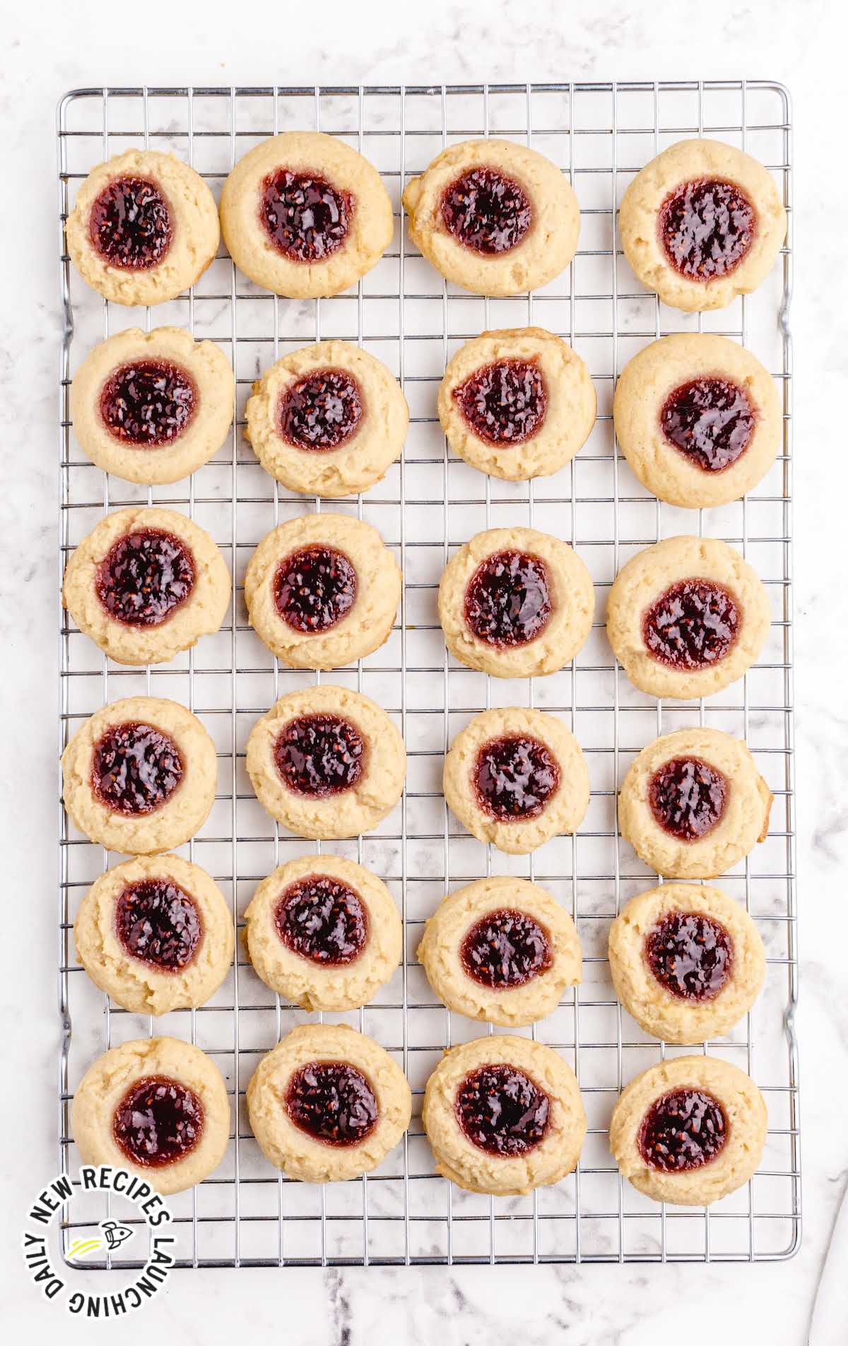 close up overhead shot of Thumbprint Cookies on a cooling rack