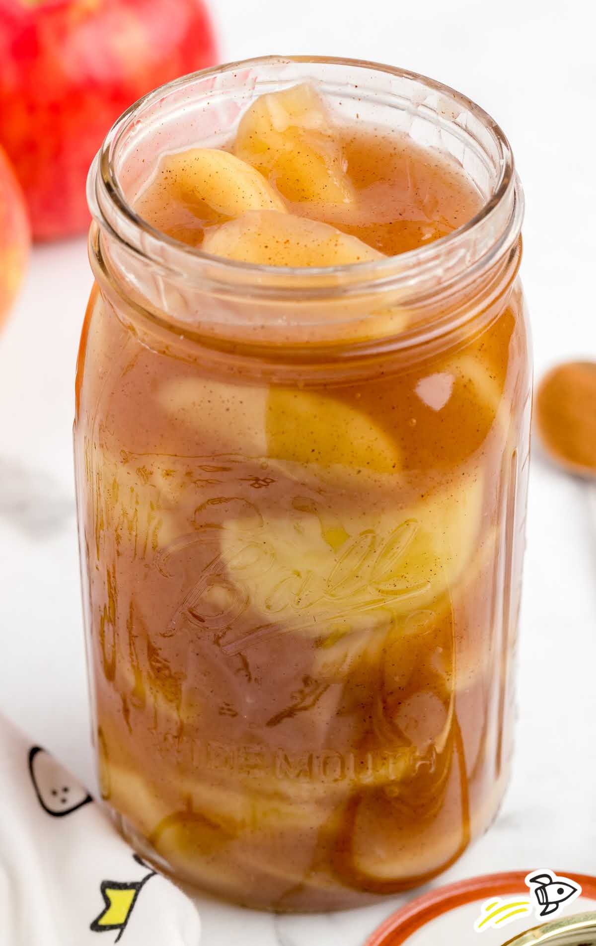 close up shot of a jar of apple pie filling