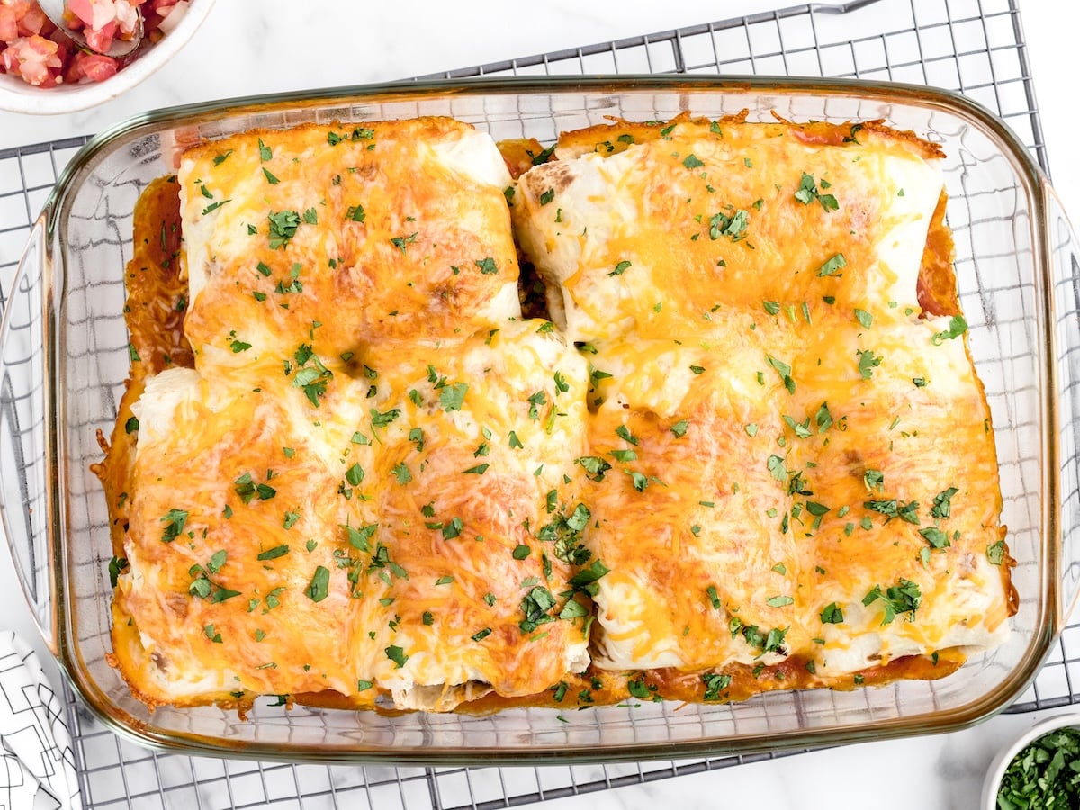 This photo is actually really good and fits the SERP well &mdash; melty cheese on top, casserole dish, exactly what people are expecting to see.
Alt text:
"Baked burritos in a glass casserole dish with melted cheese and fresh cilantro