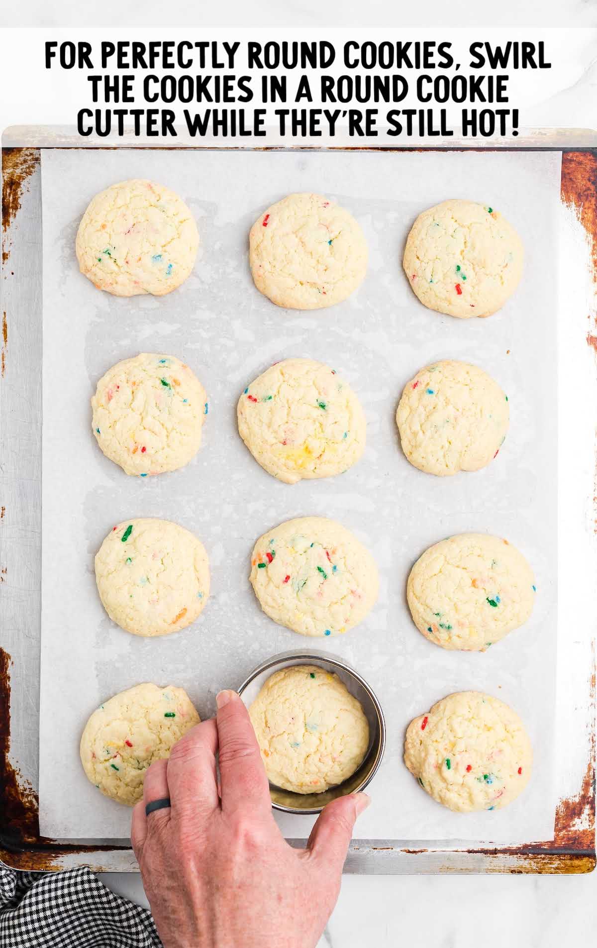 cookies are baked and rounded with a cookie cutter