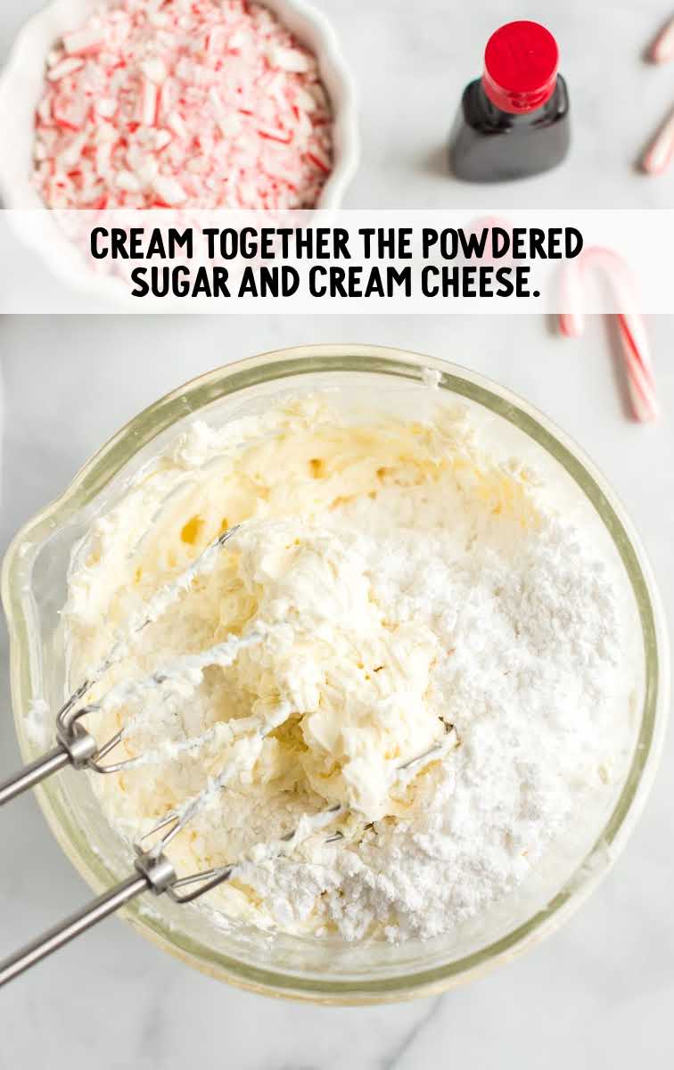 powdered sugar and cream cheese whisked  together in a bowl