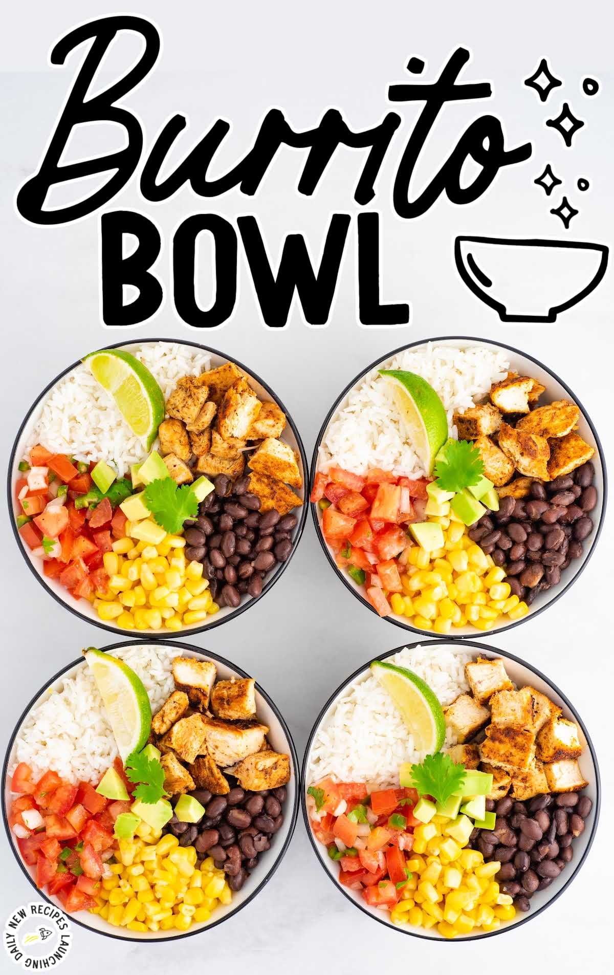 close up overhead shot of bowls of Burrito Bowl topped with slices of avocado and served with a slice of lime