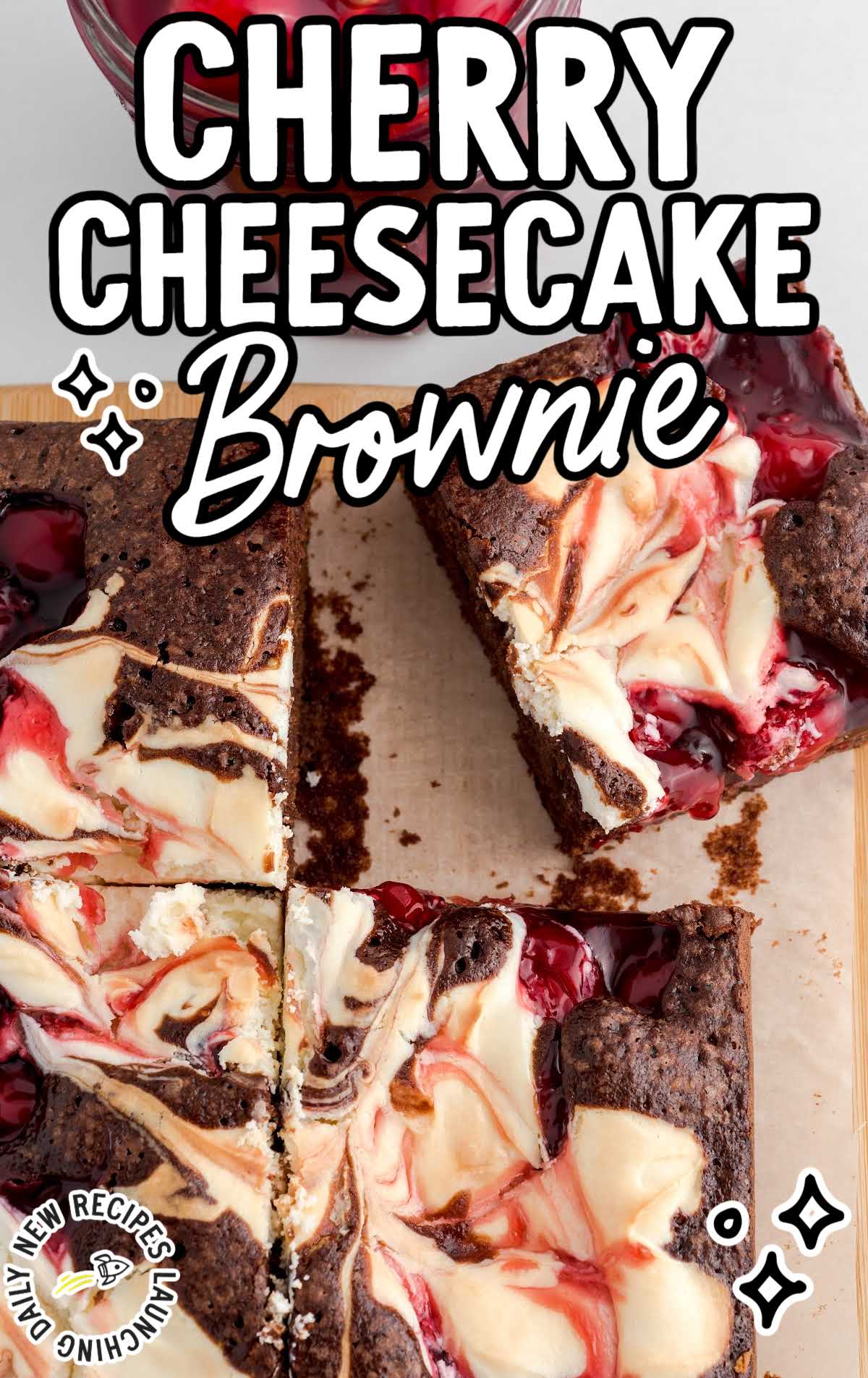 close up overhead shot of Cherry Cheesecake Brownie on a wooden board
