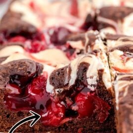 close up shot of Cherry Cheesecake Brownie on a wooden board