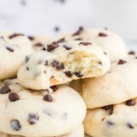 close up shot of Chocolate Chip Cheesecake Cookies stacked on top of each other
