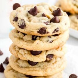 close up shot of Chocolate Chip Pudding Cookies piled on top of each other