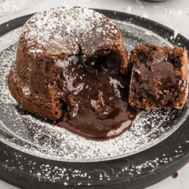 close up shot of a plate of Chocolate Lava Cake sprinkled with powdered sugar