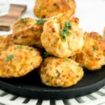 close up shot of a bunch of Copycat Red Lobster Biscuits garnished with parsley