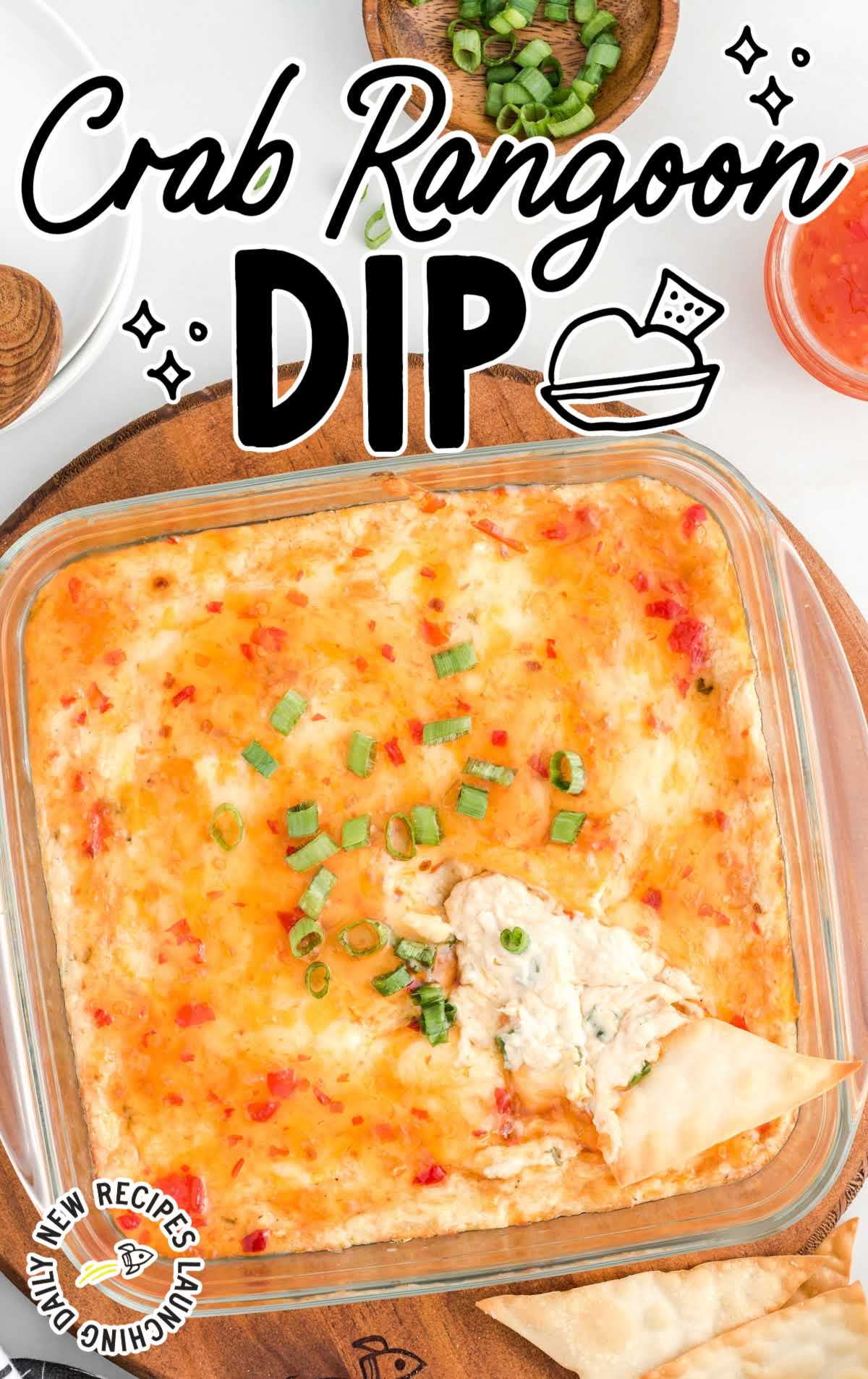 close up overhead shot of a baking dish of Crab Rangoon Dip garnished with green onions