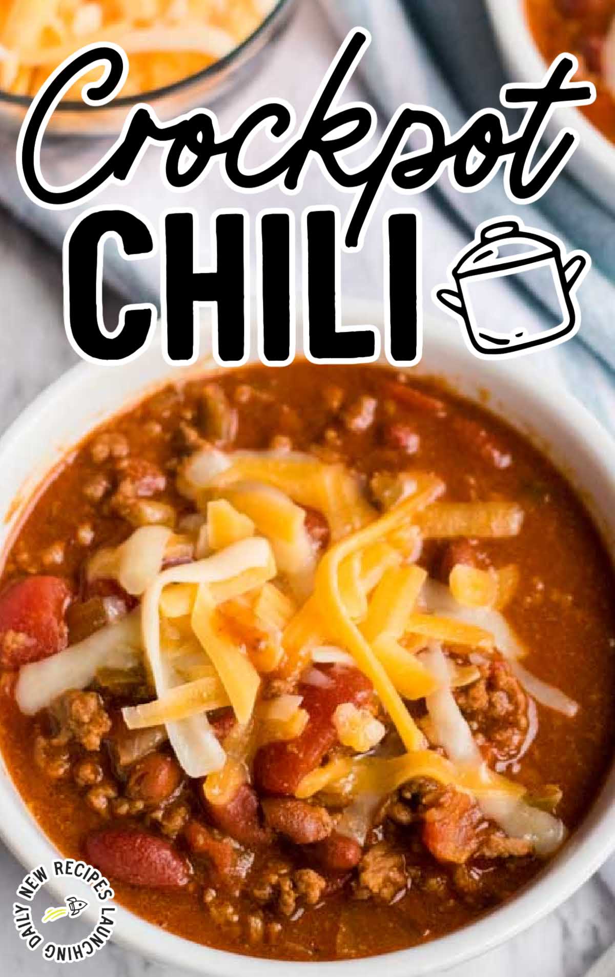 close up shot of a bowl of Crockpot Chili topped with shredded cheese