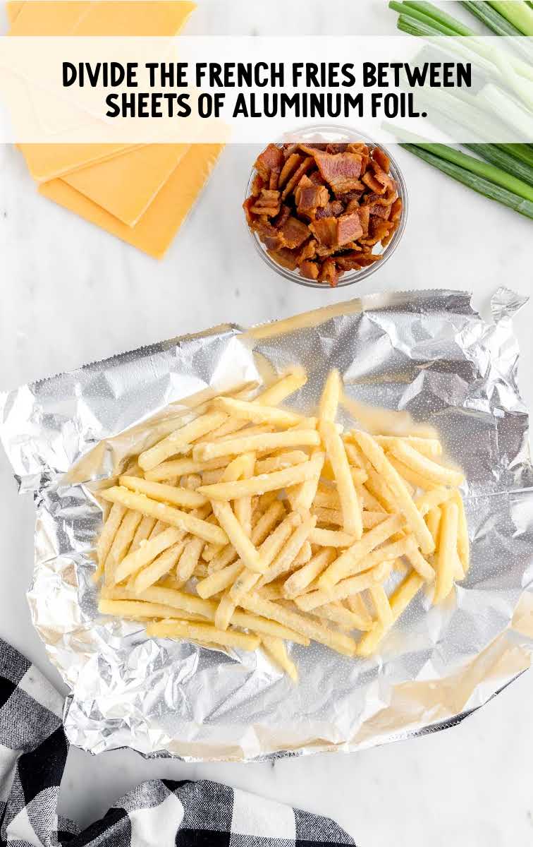 French fries placed on a sheet of aluminum foil