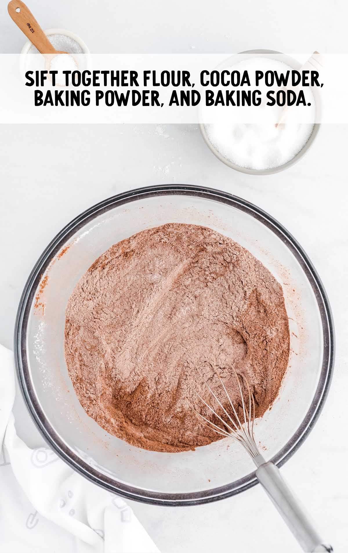 flour, cocoa powder, baking powder, and baking soda whisked together in a bowl