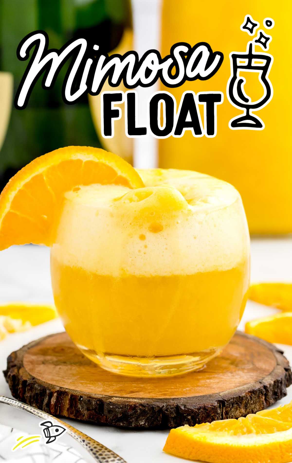 close up shot of a glass of Mimosa Float garnished with a orange slice
