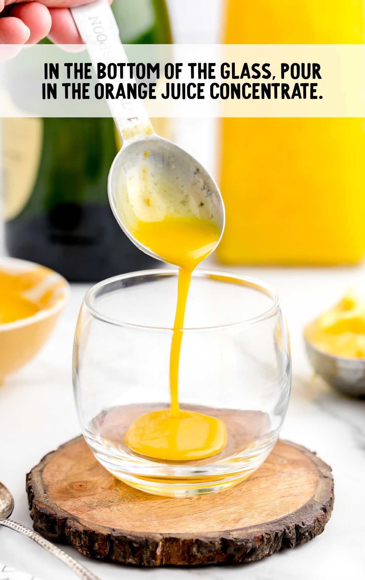 orange juice concentrate poured into a glass