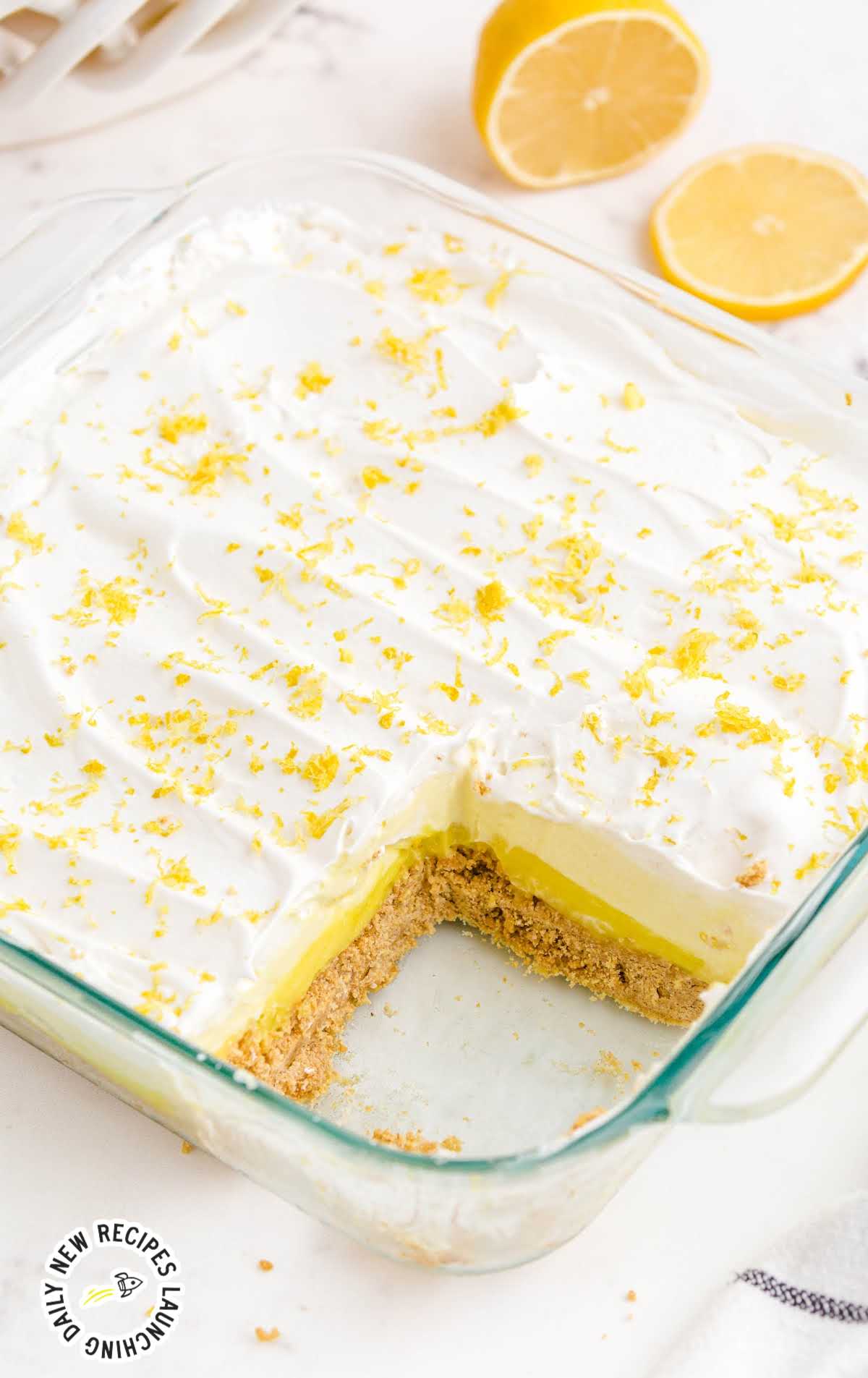 close up shot of a baking dish of No-Bake Lemon Pie garnished with lemon peel
