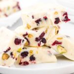close up shot of a plate of Pistachio and Cranberry Fudge