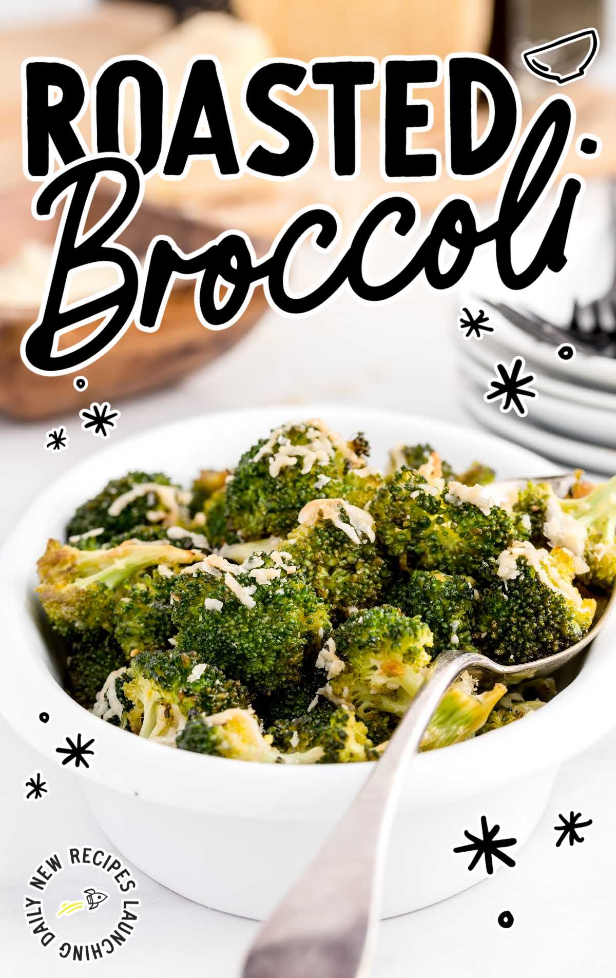 close up shot of a bowl of Roasted Broccoli with a spoon
