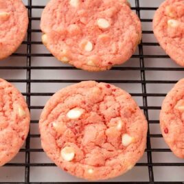 close up shot of Strawberry Cake Mix Cookies on a cooling rack