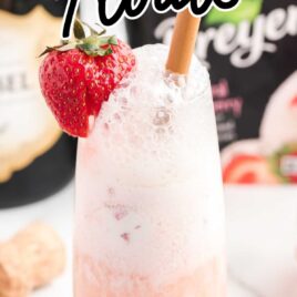 close up shot of a glass of Strawberry Champagne Floats garnished with a strawberry