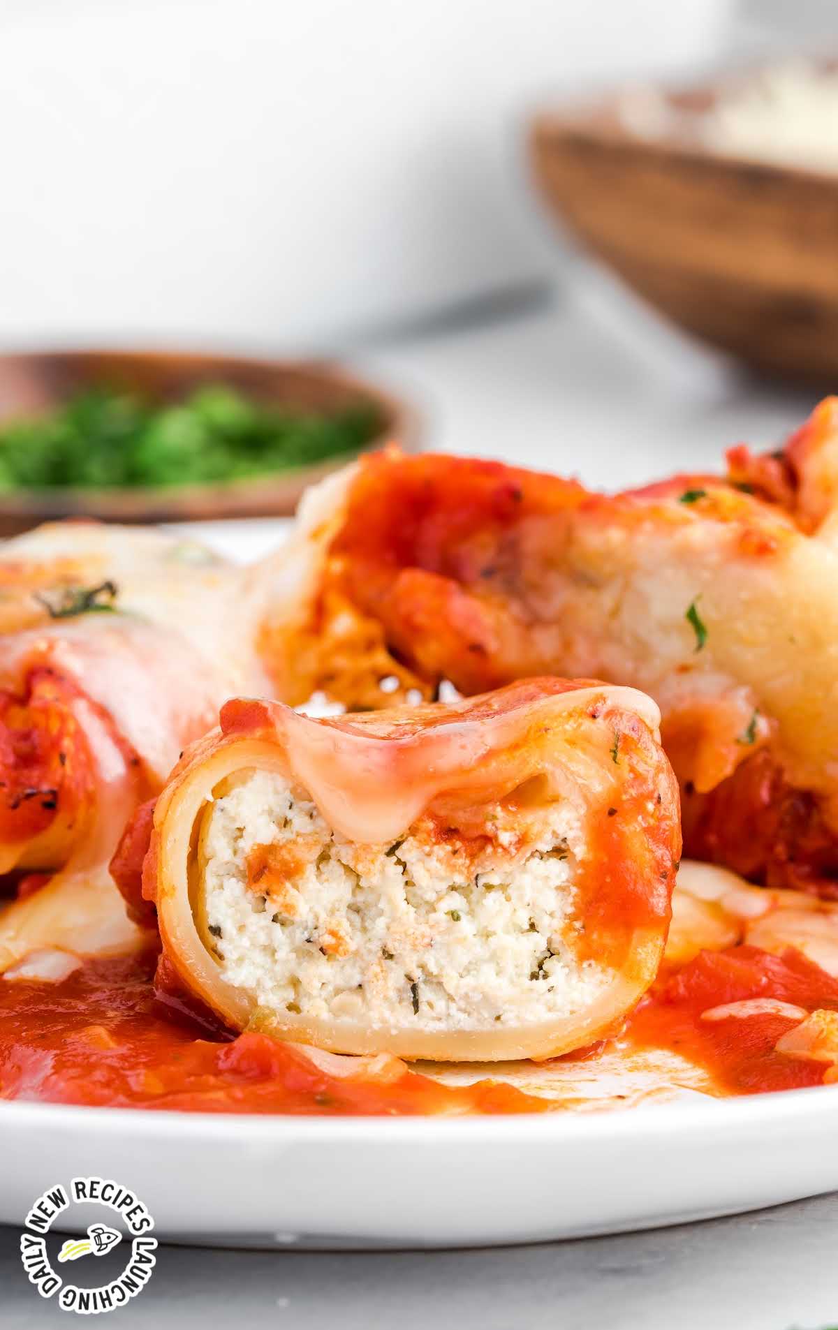 close up shot of a plate of Stuffed Shells garnished with parsley