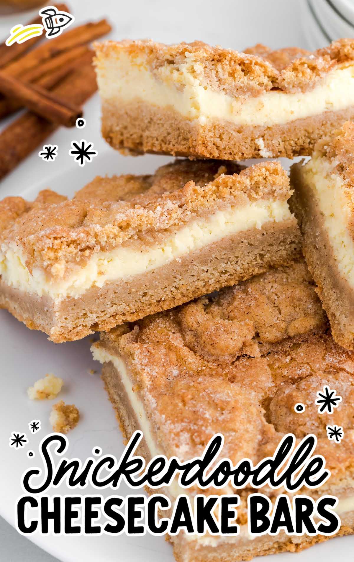 close up shot of snickerdoodle cheesecake bars piled on a plate
