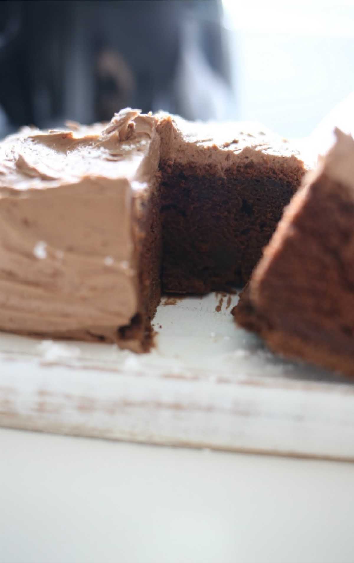 close up shot of Air Fryer Chocolate Cake with a slice being taken out